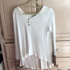 White/creamy sweater with pattern by hands